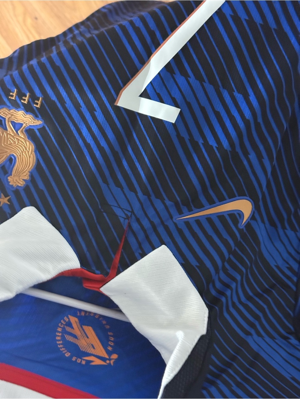 Nike Men’s Blue and Black Striped Football Jersey with Gold Accents
